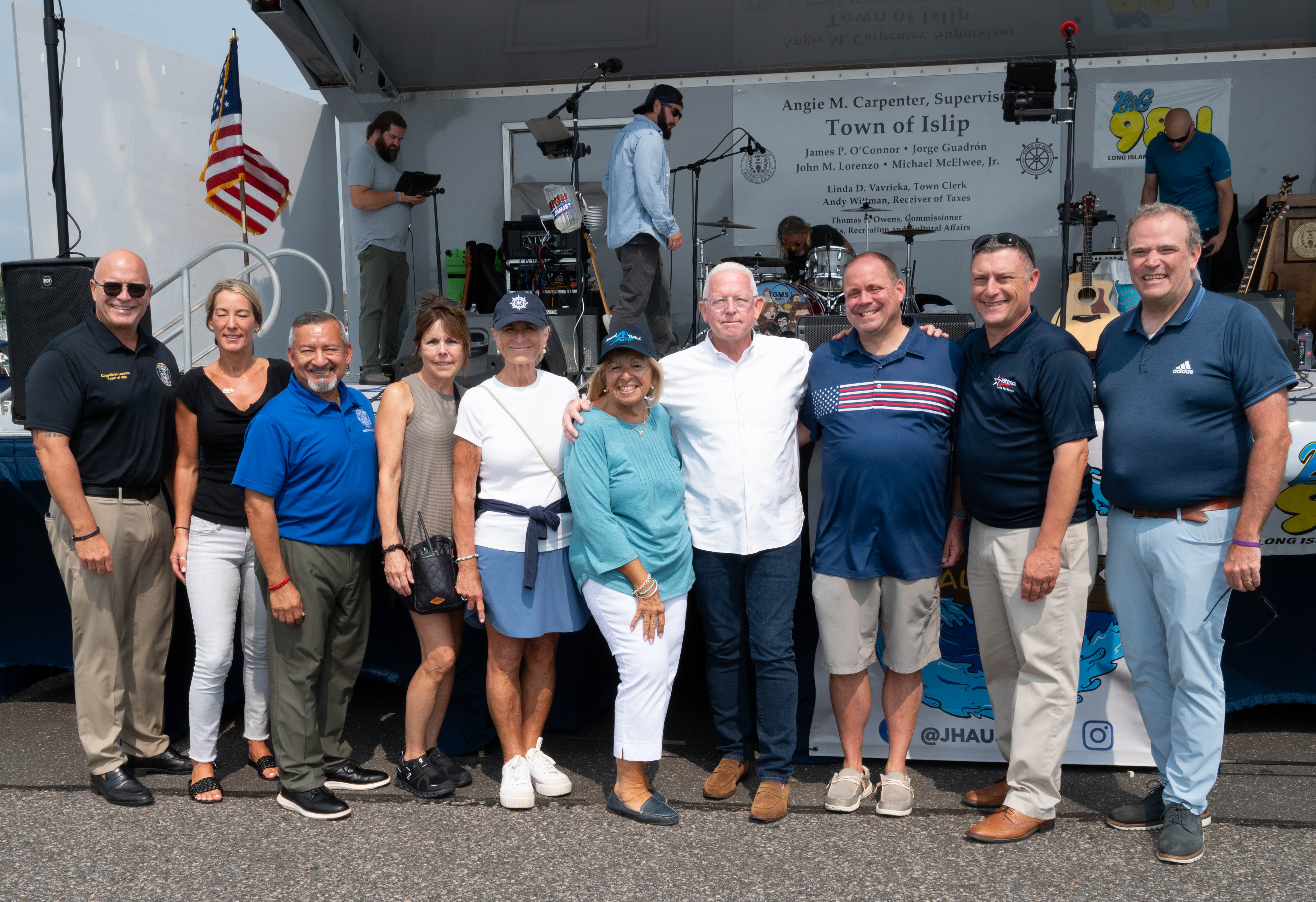 Local Officials from the Town of Islip cut the ribbon in front of the Deli