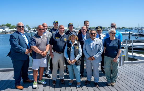 Town Supervisor Carpenter, Town, County, and Local Officials in group photo on dock