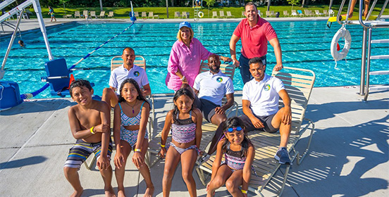 Supervisor Carpenter joins players from the New York Cosmos  Soccer team and children who were at the Family Fun Day at Roberto Clemente