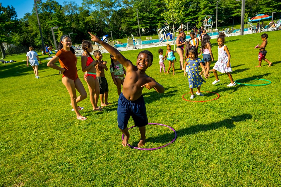 child poses at the camera during the Family Fun Day