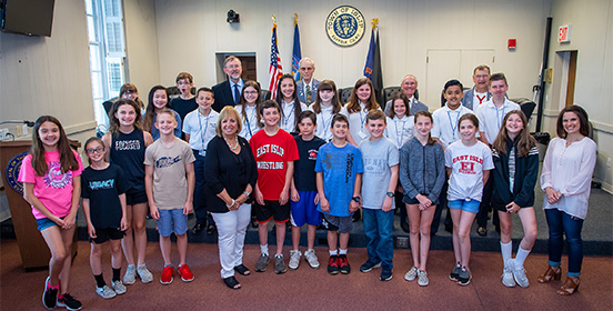 Supervisor Carpenter stands with students and the Islip Elks before the 41st Youth in Government Day