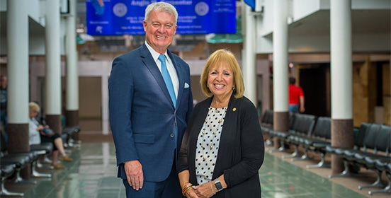 Supervisor Carpenter stands with Town of Islip IDA Executive Director Bill Mannix inside Long Island MacArthur Airport