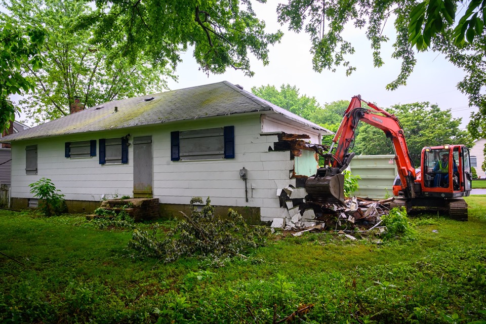 Unsafe structure is torn down off of a boarded up home in West Islip