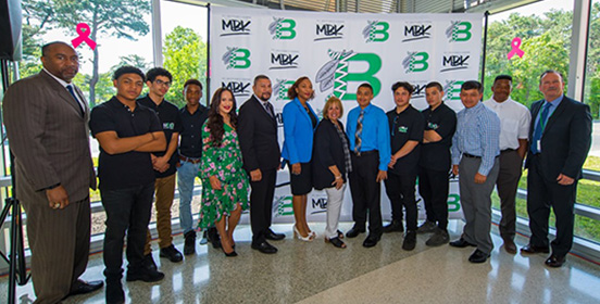 Supervisor Carpenter stands with students and administrators of the Brentwood School District at the My Brother's Keeper Brunch