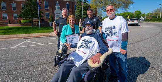 Supervisor Carpenter joins Chris Pendergast, ALS Ride for Life volunteers and Suffolk County Police officers who stopped by Islip Town Hall during the Ride for Life  