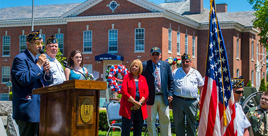 Supervisor Carpenter and Councilman John Cochrane stands with Veterans at a Memorial Day Celebration at Islip Town Hall