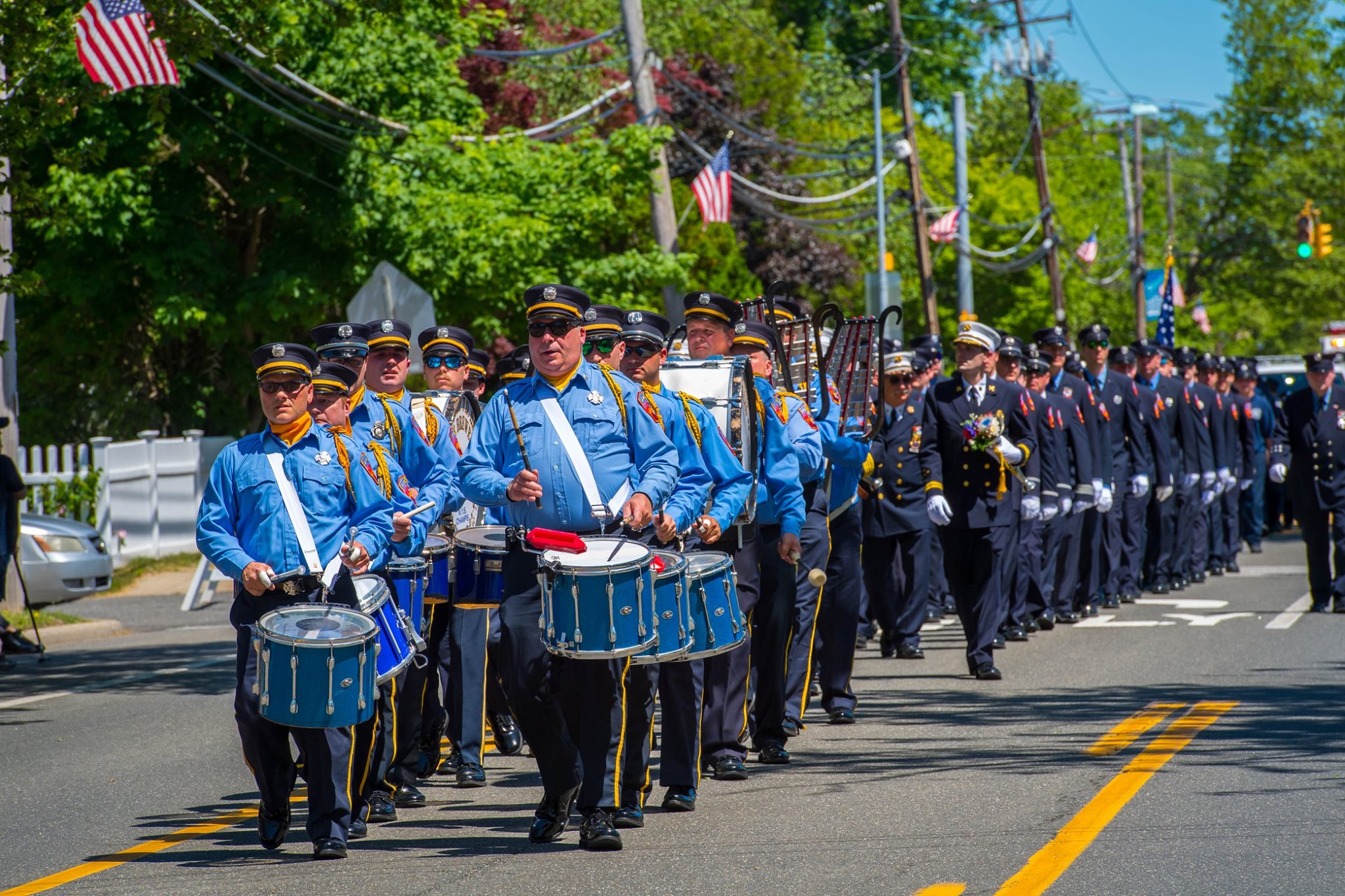 West Islip Fire Department marches down the street of the West Islip Memorial Day Parade.