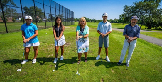 supervisor carpenter stands with jr golf pros and the golf pro of Gull Haven Golf Course after the JR PGA Tournament at Gull Haven