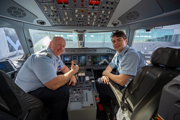 Breeze Airway Pilots sit in cockpit before flight