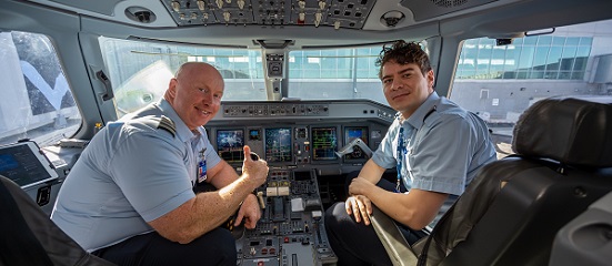 Breeze Airway Pilots sit in cockpit before flight