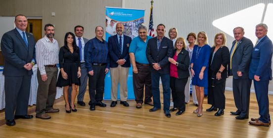 Islip Supervisor Angie Carpenter and Councilmembers Cochrane, Mullen and O'Connor pose for a photo with the award honorees.