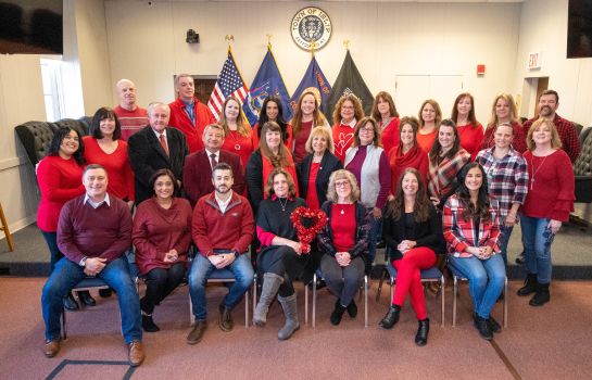 Islip employees wear red in group photo