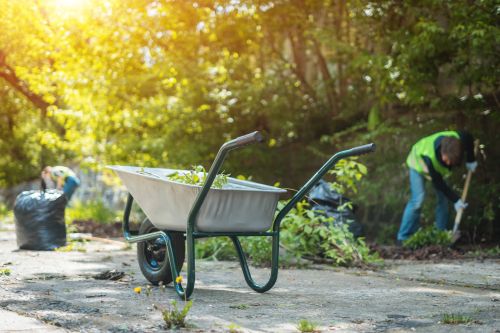 yard work with full wheel barrow