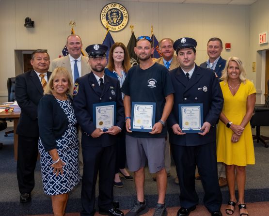 Supervisor Carpenter and the Islip Town Board stand with Firefighters Michael Hand, Matthew Arthurs and Danny Blasucci who were honored for their heroic actions rescuing a woman and her three dogs. 