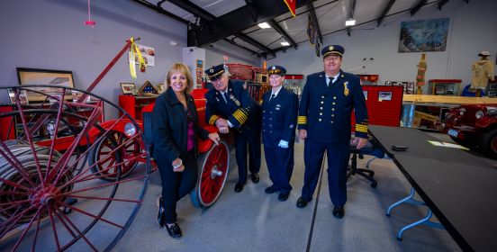 Supervisor Carpenter and Fire Representatives group photo in museum