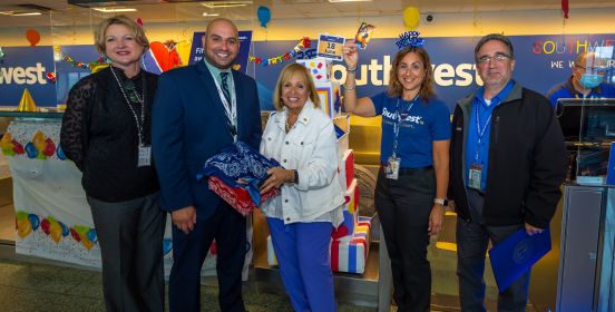 Supervisor Carpenter and Airport officials in group photo with winning ticket