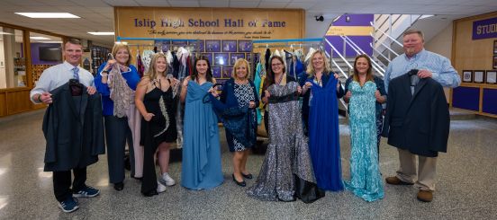 group photo with donated dresses
