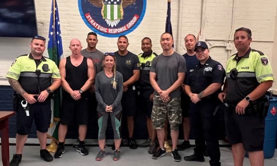 Group photo of Ranger graduates under NYPD Strategic Response Sigil