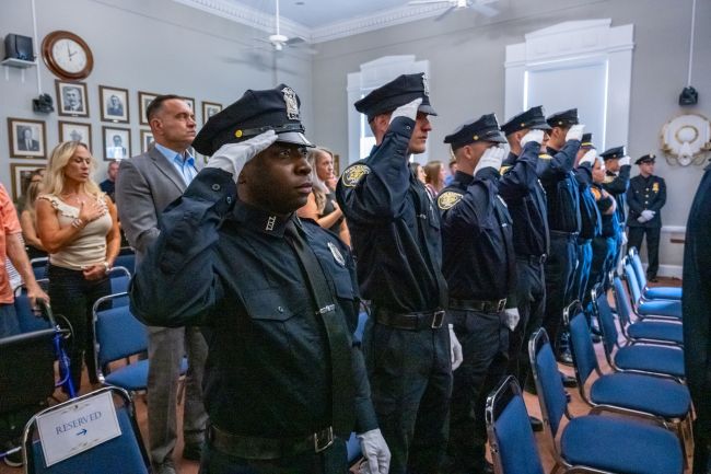 Peace Officers standing salute for National Anthem