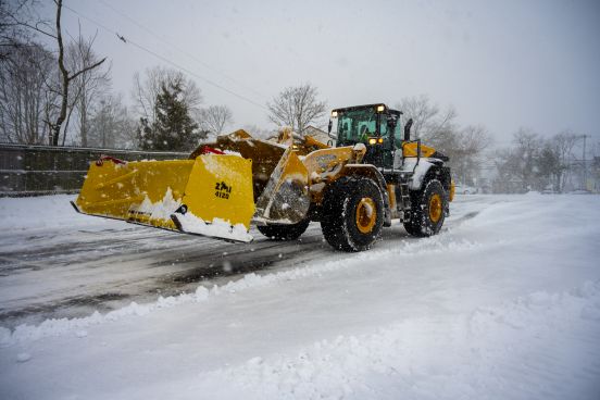 Truck liifts snow