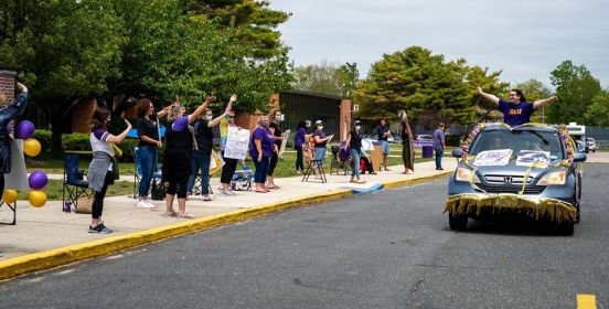 Islip Middle School Staff cheers students and cavalcade.