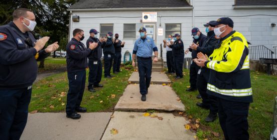 rows line either side of door as marshal walks out for last time