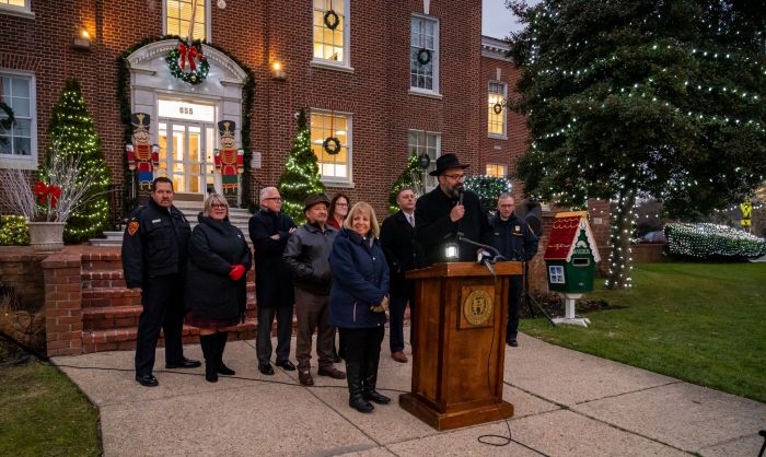 Rabbi at Podium Speaks at 2023 Menorah Lighting