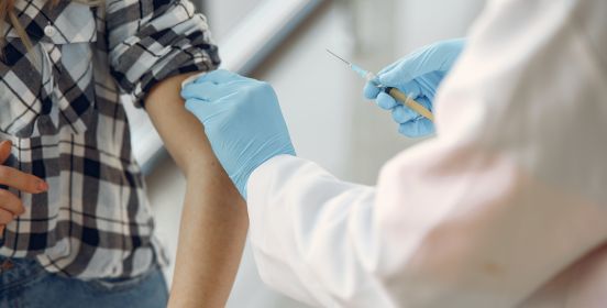 stock nurse gives patient shot