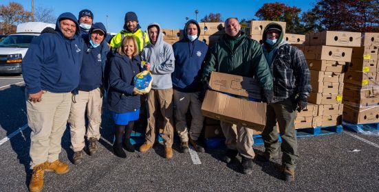 Supervisor and crews with boxes.