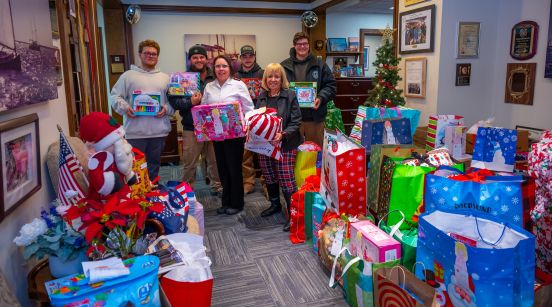 Supervisor and Salvation representatives with toys