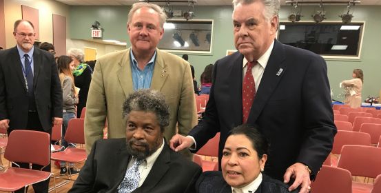 Councilman John C. Cochrane stands with Peter King and the parents of the fallen solider 