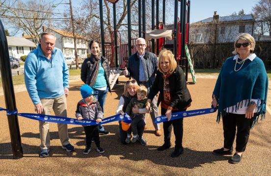 Supervisor, Councilman, Parks Officials cut ribbon on new park with children at play