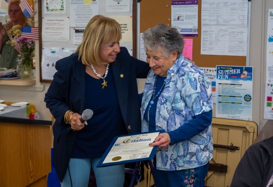 Supervisor handes Carmela Town Citation of Recognition