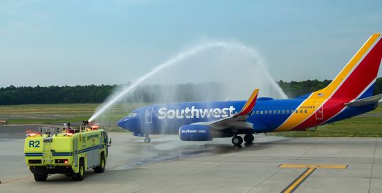 Plane rolls through water jets