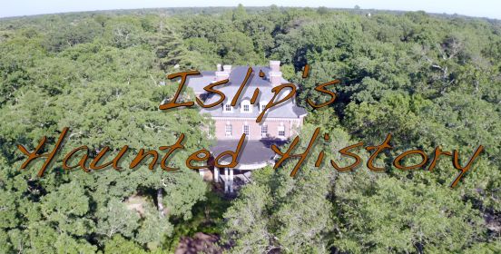 A drone shot above the treeline with Brookwood Hall peaking through in the clearing, the words "Islip's Haunted History" written on screen in brown text.