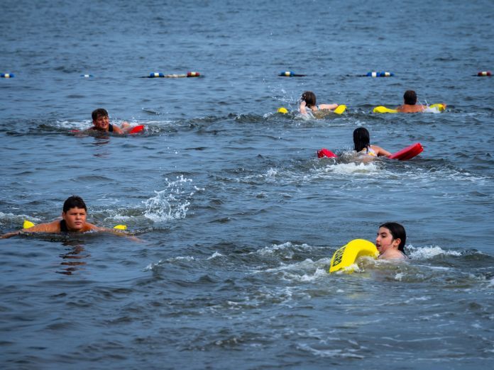 Trainees swim out to bouys and back