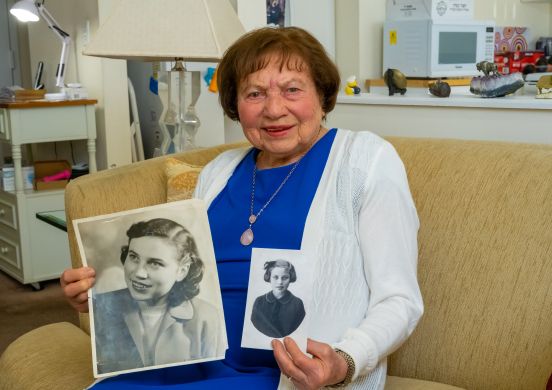 Edith holding old photographs