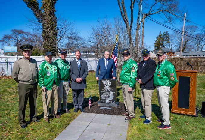 Veterans group shot with memorial