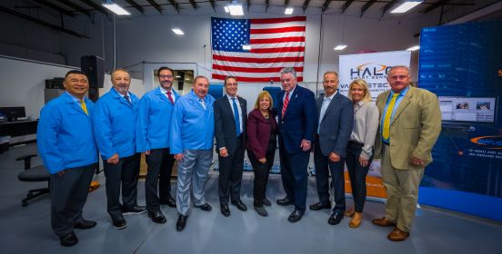 Supervisor Carpenter, Congressman Peter King, Councilmembers Cochrane and Mullen stands with Technology staff for a photo infront of the USA flag.