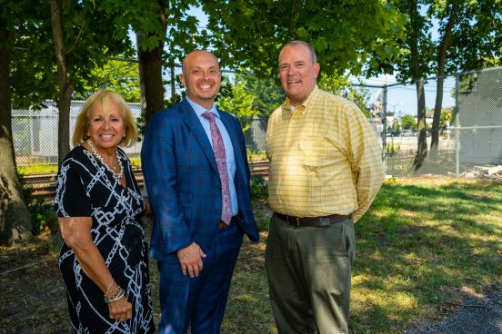 Suipervisor, Congressman, and Councilman in group photo.