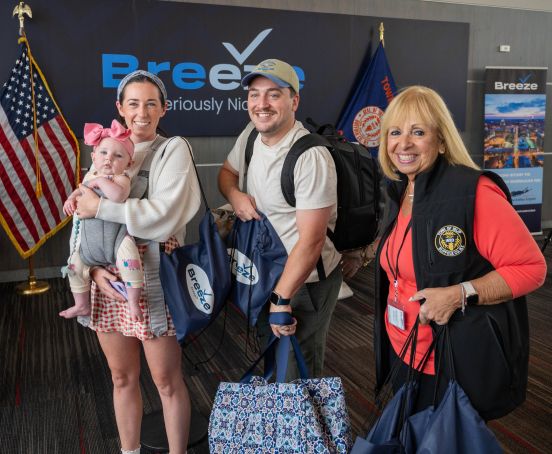 Angie and a family in a photo op