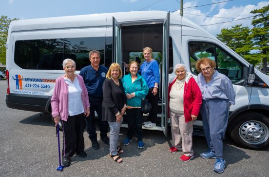 Seniors in front of bus