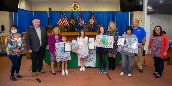 Supervisor, DEC Commissioner Bellew and Poster Contest Winners in a group photo with their posters