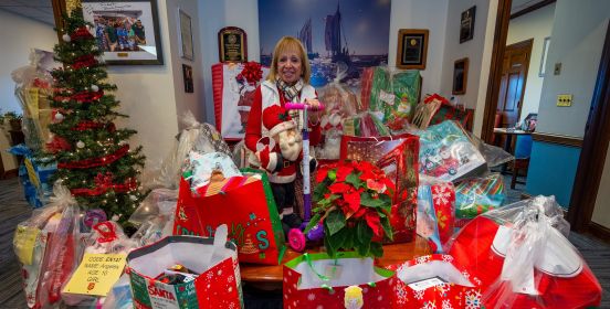 Supervisor surrounded by presents