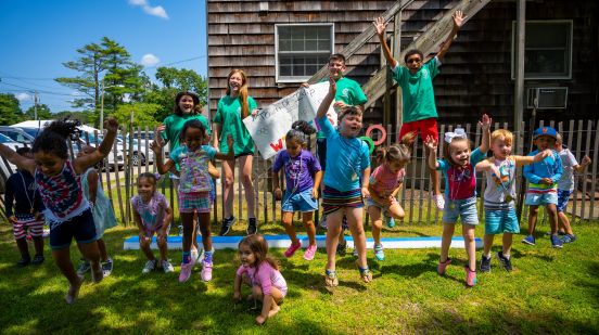 kids at the camp jump for joy