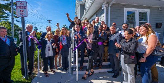 group shot infront of the new mental health clinic