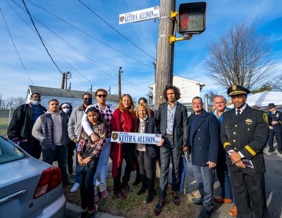 Supervisor Carpenter, Inv. Sgt. Allison's family and local officials in group photo under new Street sign.