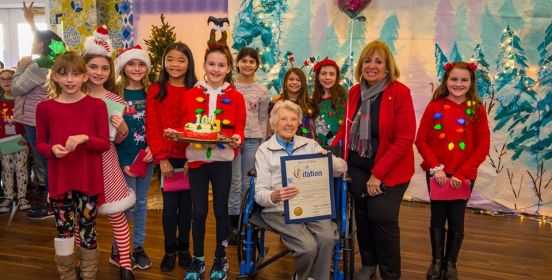  Supervisor Carpenter poses for a photo with Rose Santoro   who turned 101 surrounded by students of Sycamore Avenue   Elementary School who came to sing Christmas carols.