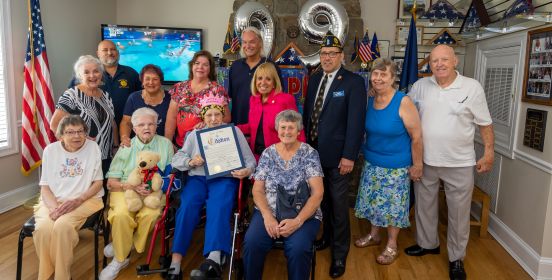 Supervisor poses with 99 year old Veteran