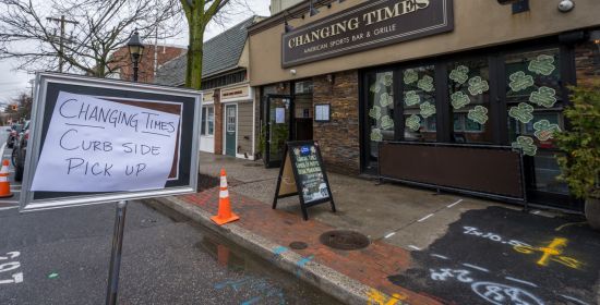 outside changing times restaurant, a sign for curbside pick-up only